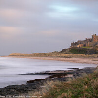 Buy canvas prints of Bamburgh Castle misty sea by Lee Kershaw