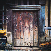 Buy canvas prints of Ancient weathered wooden doorway by Chris Rose
