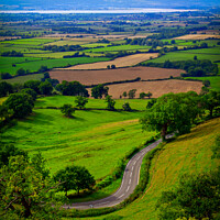 Buy canvas prints of Coaley Peak Viewpoint, winding road by Chris Rose