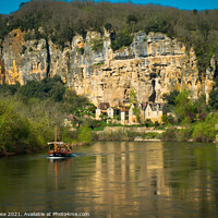 Buy canvas prints of A sightseeing boat passes La Roque-Gageac by Chris Rose