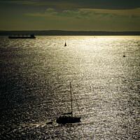 Buy canvas prints of A silhouetted sailing boat by Chris Rose