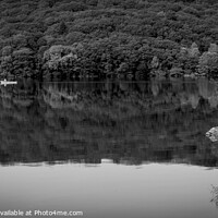 Buy canvas prints of A couple pass in a canoe on Coniston Water by Chris Rose