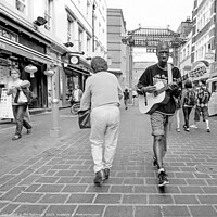 Buy canvas prints of Guitarist - Chinatown by Phil Robinson