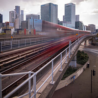Buy canvas prints of DLR arriving in front of Canary Wharf by Stephen Coughlan
