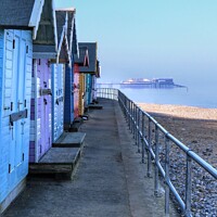 Buy canvas prints of Cromer Pier and Beach Huts by Laura Baxter
