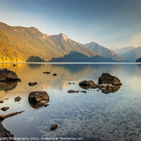 Buy canvas prints of Rocks on a smoky lake shore by Pierre Leclerc Photography