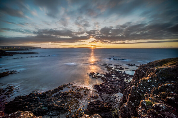 Ringaree sunset Portrush Picture Board by Arnie Livingston