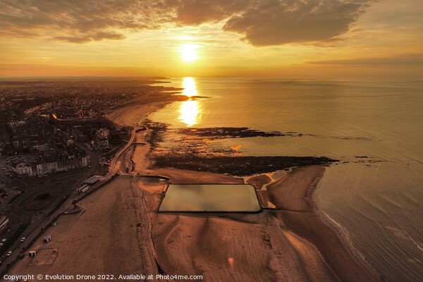 A sunset over a body of water Picture Board by Evolution Drone