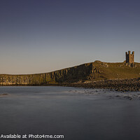 Buy canvas prints of Dunstanburgh Castle at sunset by Duncan Spence