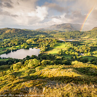 Buy canvas prints of Serene Sunrise Over Loughrigg Tarn by Terry Newman