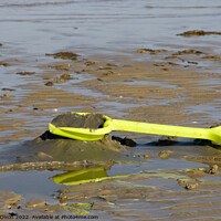 Buy canvas prints of Abandoned yellow spade on Weymouth beach by Gordon Dixon