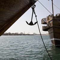Buy canvas prints of Cargo dhow bows and anchor, moored in Dubai creek UAE by Gordon Dixon