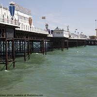 Buy canvas prints of Brighton Pier at high tide by Gordon Dixon