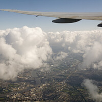 Buy canvas prints of High above London, onroute to Heathrow with London and the Thames below by Gordon Dixon