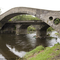 Buy canvas prints of The 'Old Bridge' spanning the River Taff at Pontypridd, South Wales by Gordon Dixon