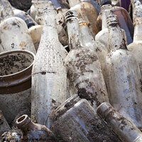Buy canvas prints of A selection of old glass bottles excavated from a building site in Surrey by Gordon Dixon