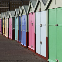 Buy canvas prints of A row of beach huts stretching to infinity (almost) on the seafront - Brighton and Hove by Gordon Dixon