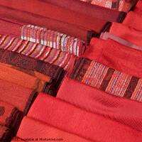 Buy canvas prints of Selection of Red hand-made scarfs for sale by Gordon Dixon