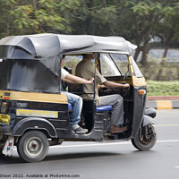 Buy canvas prints of Autorickshaw driving down a road with passenger - Delhi, India by Gordon Dixon