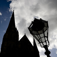 Buy canvas prints of Iconic spire of Salisbury Cathedral and ornate street lamp in silhouette by Gordon Dixon