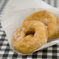 Buy canvas prints of Freshly made doughnuts bought from a kiosk at West Bay, Dorset by Gordon Dixon