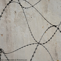 Buy canvas prints of Razor wire outside an abandoned prison 's walls in Pudu, Kuala Lumpur. by Gordon Dixon