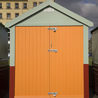 Buy canvas prints of Orange coloured beach hut on the esplanade, Brighton and Hove by Gordon Dixon