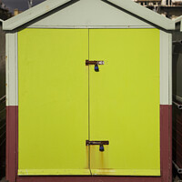 Buy canvas prints of Lime green door of a sea front beach hut, Brighton and Hove by Gordon Dixon