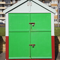 Buy canvas prints of Bright green painted door of a sea front beach hut, Brighton and Hove by Gordon Dixon