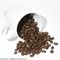Buy canvas prints of Roasted coffee beans spilling out of a mug - white background by Gordon Dixon