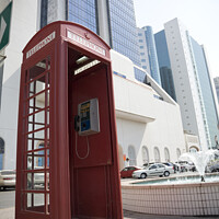 Buy canvas prints of An old British telephone box stood on the pavement in Dubai  by Gordon Dixon