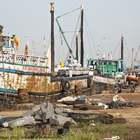 Buy canvas prints of Cargo ships lined up along the quay - Mangalore, India by Gordon Dixon