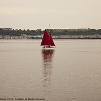 Buy canvas prints of Yacht with red sails set approaches Cardiff Bay, South Wales by Gordon Dixon