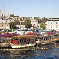Buy canvas prints of Suleymaniye Mosque and restaurant boats - Eminonu waterfront, Istanbul by Gordon Dixon