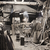 Buy canvas prints of Old blacksmith's shop - with ghost-like figure  by Gordon Dixon