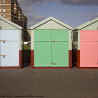 Buy canvas prints of Three beach huts in pastel shades - Brighton by Gordon Dixon