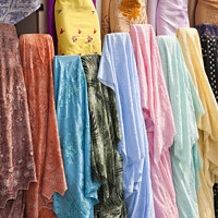 Buy canvas prints of Colourful Arabian Ladies clothing - Dubai by Gordon Dixon