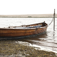 Buy canvas prints of Rowing boat moored in Fleet lagoon, Chesil Bank, Dorset by Gordon Dixon