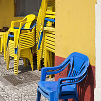 Buy canvas prints of Colourful street scene - Stacking chairs - Curitiba, Brazil by Gordon Dixon