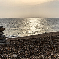Buy canvas prints of Tranquil beach with stone sculpture and sun on water (watercolour)  - Dorset by Gordon Dixon