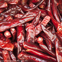Buy canvas prints of Shiny red dried chillies for sale on a market stall in Seoul, South Korea  by Gordon Dixon
