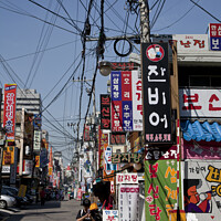 Buy canvas prints of Colours and chaos of a Seoul backstreet by Gordon Dixon