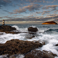 Buy canvas prints of Trwyn Du lighthouse and Puffin Island by Dave Urwin