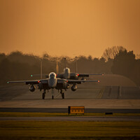 Buy canvas prints of USAF Eagles Rolling Out During Sunset  by Liam Roberts