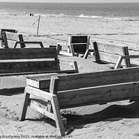 Buy canvas prints of Wodden benches on the beach on Den Haag by Veronika Druzhnieva