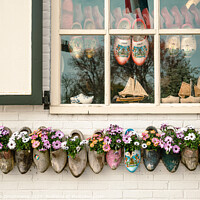 Buy canvas prints of Bright Blossoms Wooden Clogs in Marken by Veronika Druzhnieva