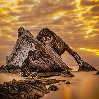 Buy canvas prints of Sunrise at Bow Fiddle Rock in Scotland by DAVID FRANCIS