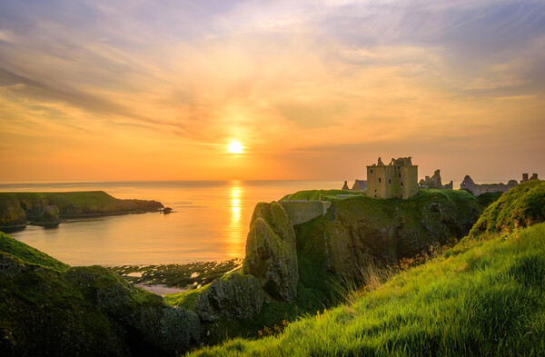 Sunrise at Dunnottar Castle near Stonehaven Picture Board by DAVID FRANCIS