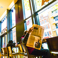 Buy canvas prints of Man reading The Financial Times in a Costa coffee shop by Rose Sicily