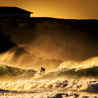 Buy canvas prints of Surfing in wild seas during a golden sunset at Fis by Gordon Scammell